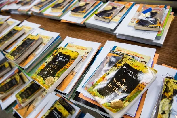 A Wrinkle in Time book among supplies arranged for parents to pick up for distance learning 