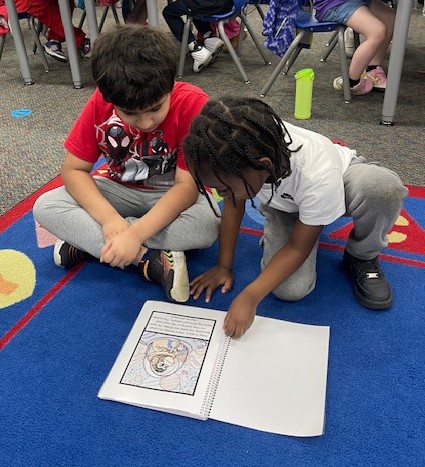 Gudith children make books with Woodhaven High School students