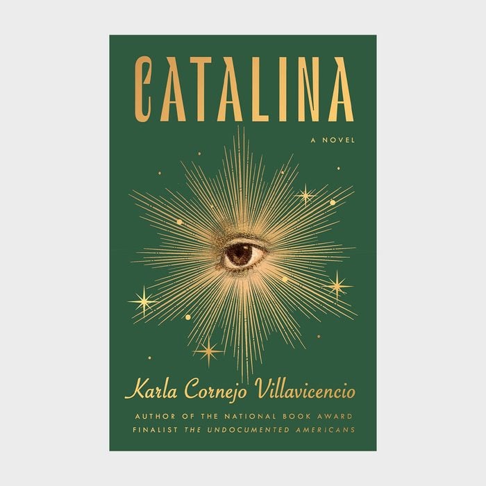 Cover displays a central eye radiating golden rays, surrounded by stars on a green background. Title:
