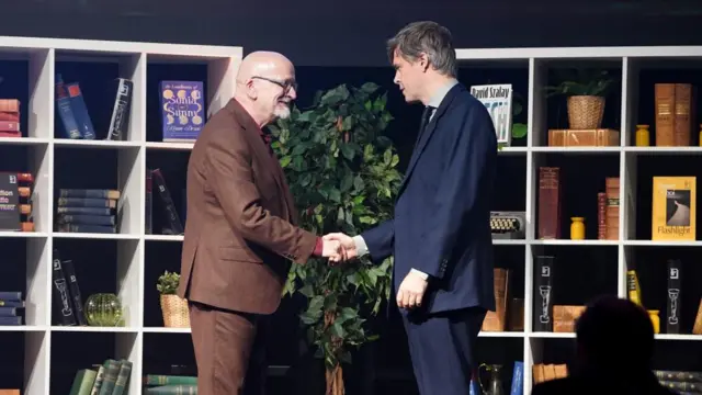 Roddy Doyle (left) shakes hands with David Szalay after David is named as the winner of the 2025 Booker Prize for the novel Flesh at Old Billingsgate, London